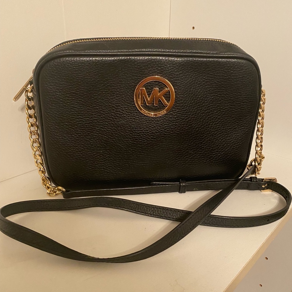 Michael Kors crossbody bag with gold emblem